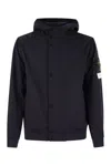 Stone Island Black Jacket With Hood With Buttons And Logo Patch On The Sleeve In Tech Fabric Stretch Man In Navy