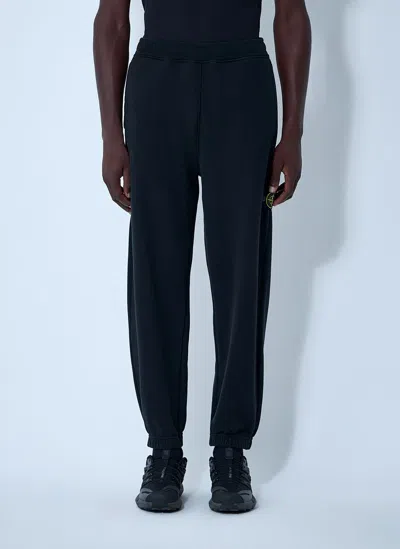 Stone Island Logo Patch Track Pants In Black