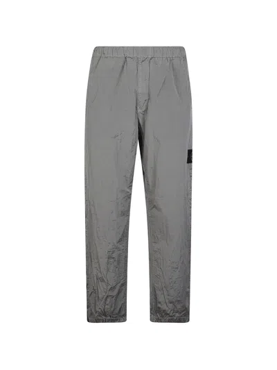 Stone Island Logo-patch Crinkled Trousers In Gray
