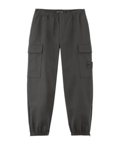 Stone Island Loose-fit Cargo Trousers With Elasticated Zipped Cuffs In Green