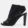 Stuart Weitzman Black Leather Cutout Elastic Booties In Black