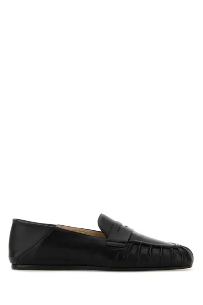 STUART WEITZMAN BLACK SLIP ON LOAFERS