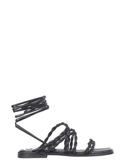 Stuart Weitzman Mini Calypso Sandals With Slave Laces In Black
