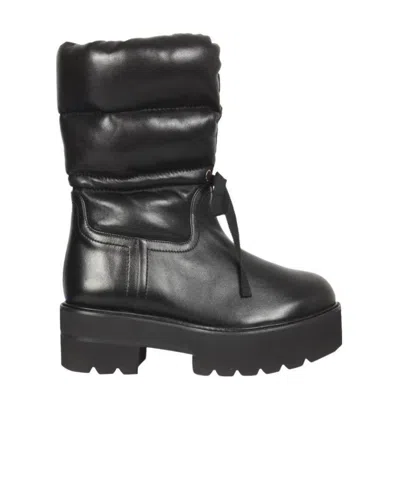 STUART WEITZMAN STRAPPING DESIGN AND ANKLE BOOTS