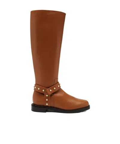 Stuart Weitzman Leather Pearl Moto Boots In Brown
