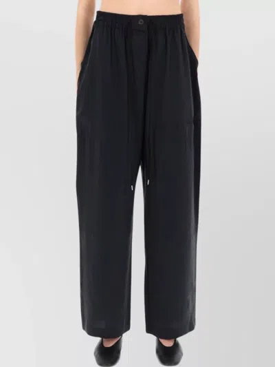 Studio Nicholson Comfortable Trousers Featuring Side Pockets In Black