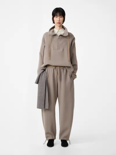 Studio Nicholson Funnel Neck Wool Top In Neutral