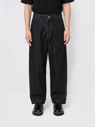 Studio Nicholson Pants Men In Black