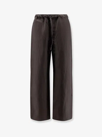 Studio Nicholson Linen And Wool Blend Trousers In Brown