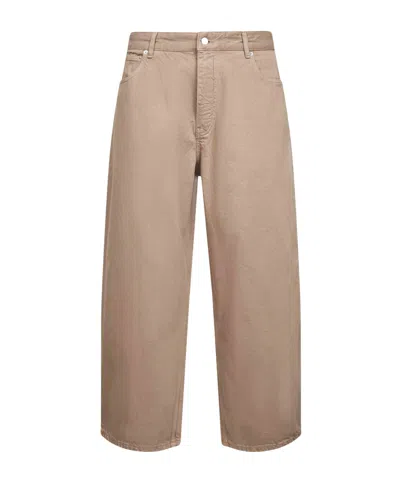 Studio Nicholson Logo Denim Trousers In Brown