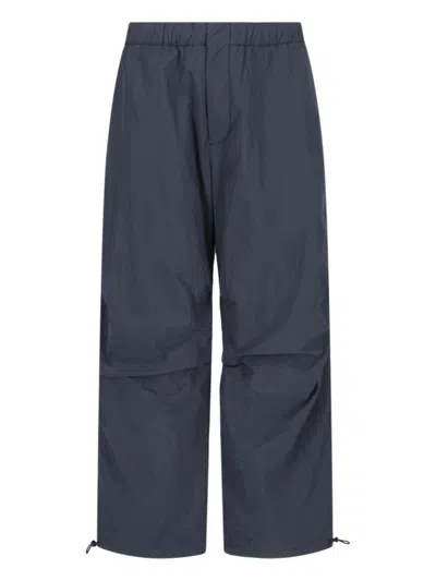 STUDIO NICHOLSON NIXIE" BLUE NYLON TROUSERS