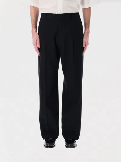 STUDIO NICHOLSON PANTS STUDIO NICHOLSON MEN COLOR BLACK,G96474002
