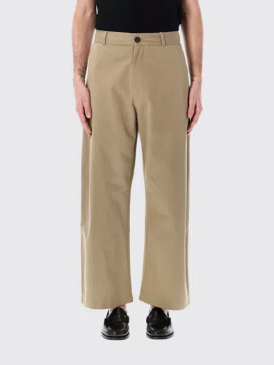 STUDIO NICHOLSON PANTS STUDIO NICHOLSON MEN COLOR BROWN,G76870032