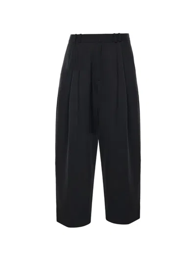 Studio Nicholson Pleated-front Tailored Trousers In Black