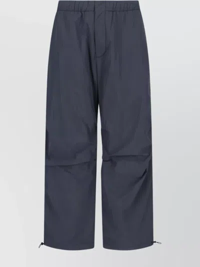STUDIO NICHOLSON STRAIGHT TROUSERS WITH ELASTIC WAISTBAND AND DRAWSTRING HEM