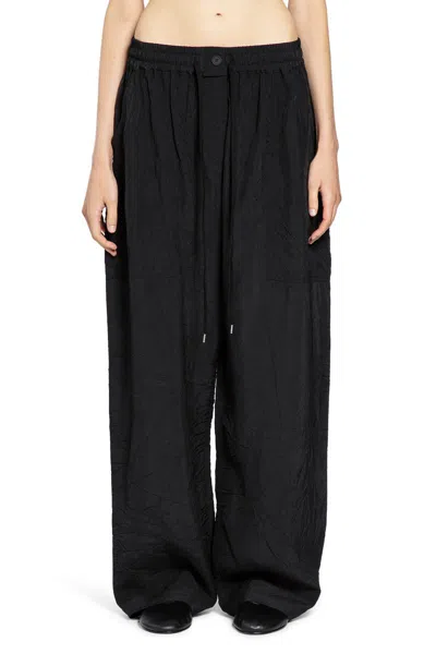 Studio Nicholson Trousers In Black