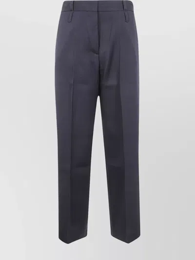 STUDIO NICHOLSON TROUSERS WITH HIGH WAIST AND FRONT PLEATS