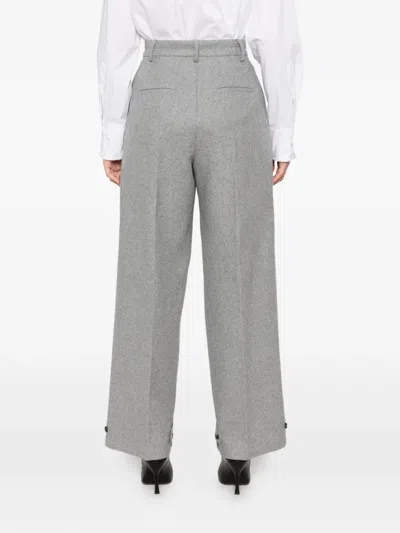 Su Button-cuff Wool Trousers In Yellow