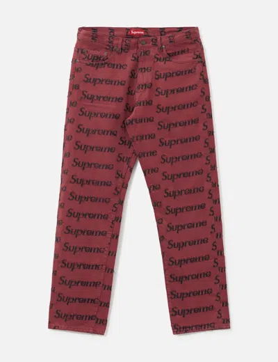 Supreme Frayed Logo Denim Jeans In Burgundy