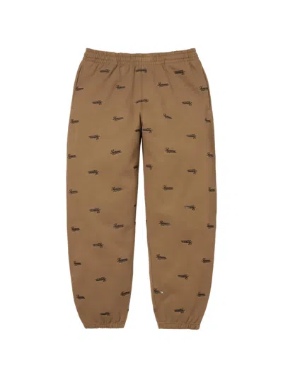 Supreme Repeat Script Track Pants In Brown