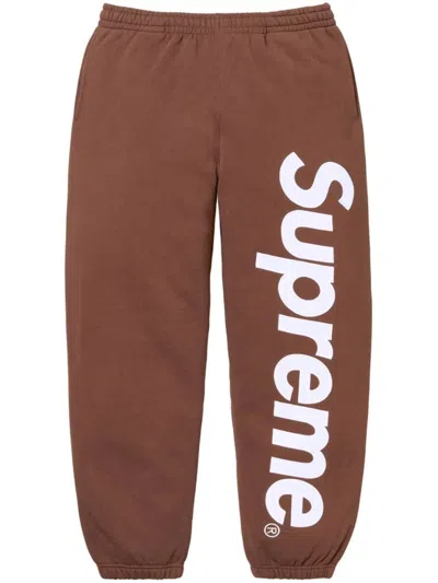 Supreme Satin-appliqué Cotton Track Pants In Brown