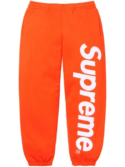 Supreme Satin-appliqué Cotton Track Pants In Orange