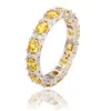 Suzy Levian Sterling Silver Round Cut Yellow Sapphire And Diamond Accent Eternity Band In Silver