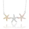 Suzy Levian Sterling Silver White Topaz Tri-tone Starfish Trio Necklace In Metallic