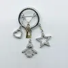 Swarovski Rhodium Key Heart Star And Doll Charms Circle Brooch In Silver