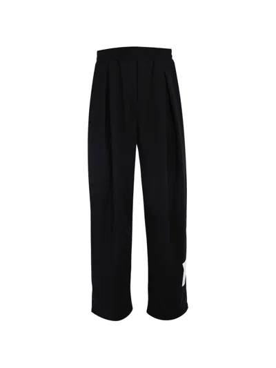 Tee Library Rip-off Pleated Logo-patch Trousers In Black