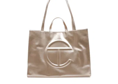 Pre-owned Telfar Shopping Bag Large In Gold