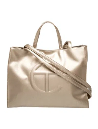 Pre-owned Telfar Vegan Leather Shopping Bag Medium In Gold/metallic