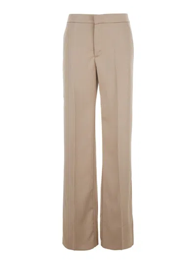 THE ANDAMANE BEIGE PANTS WITH PENCES ON THE FRONT