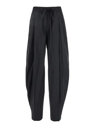 THE ANDAMANE BLACK PANTS WITH CANNON PLEATS AND ELASTIC WAIST WITH DRAWSTRING