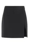 The Andamane Fitted Black Mini Skirt With Subtle Slit Detail In Black