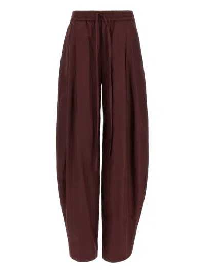 THE ANDAMANE PLEATED TAPERED TROUSERS