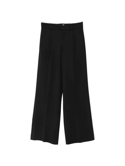 The Andamane Pleated Wide-leg Trousers In Black