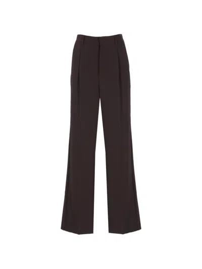 The Andamane Pleated Wide-leg Trousers In Brown
