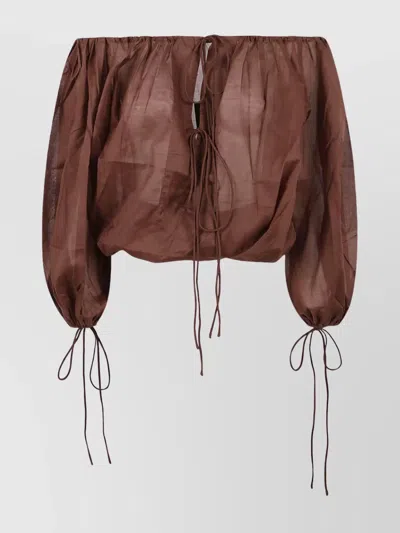 The Andamane Sheer Drawstring Long Sleeve Top
