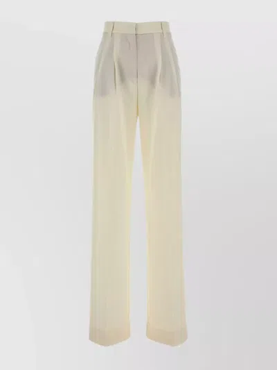 THE ANDAMANE STRETCH GABARDINE PALAZZO TROUSERS FEATURING PLEATS