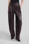 The Andamane Maxi Flare Vegan Leather Trousers In Burgundy