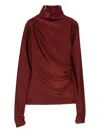 The Andamane Turtleneck Blouse In Black