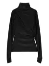 The Andamane Turtleneck Blouse In Black