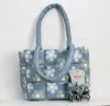The Care Collective Daisy Puffer Bag In Blue/green In Multi