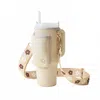 The Darling Effect Tumbler Crossbody Sling Holder In Tan