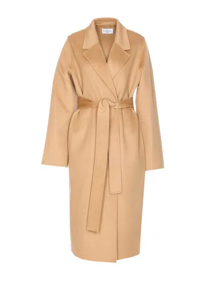 The Dynamis Studio Coats In Brown