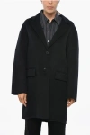 The Dynamis Studio Unlined Wool Coat With Flap Pockets In Black