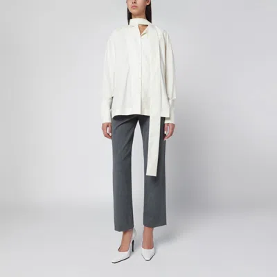 THE LATEST BUTTER-COLORED SHIRT WITH SCARF DETAIL
