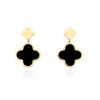 The Lovery Onyx And Gold Clover Drop Earrings