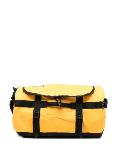 The North Face Buckle Strap Backpack In Yellow